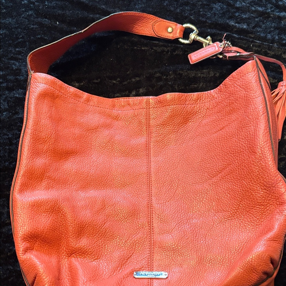 Chic Orange Leather Hobo Bag by Coach